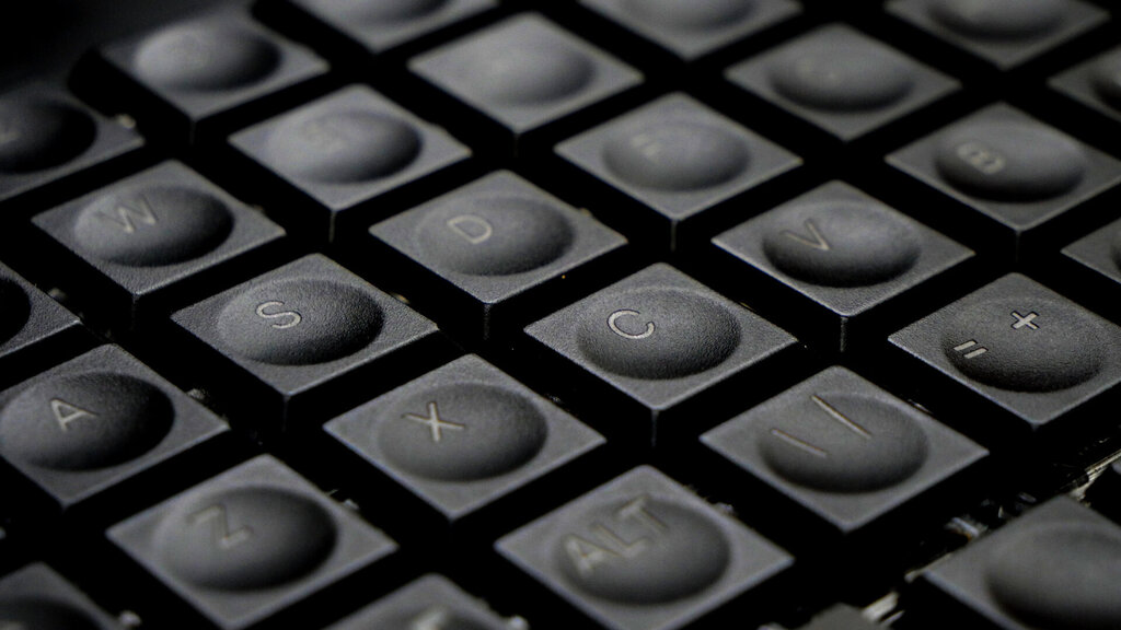 Closeup of MNT Pocket Reform Keycaps, engraved